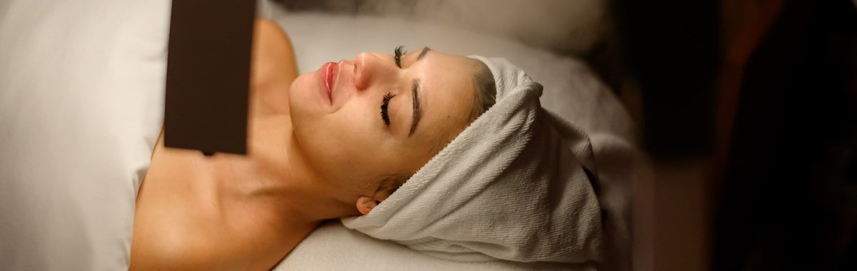 Woman on a facial treatment bed at Sonder Beauty Studio