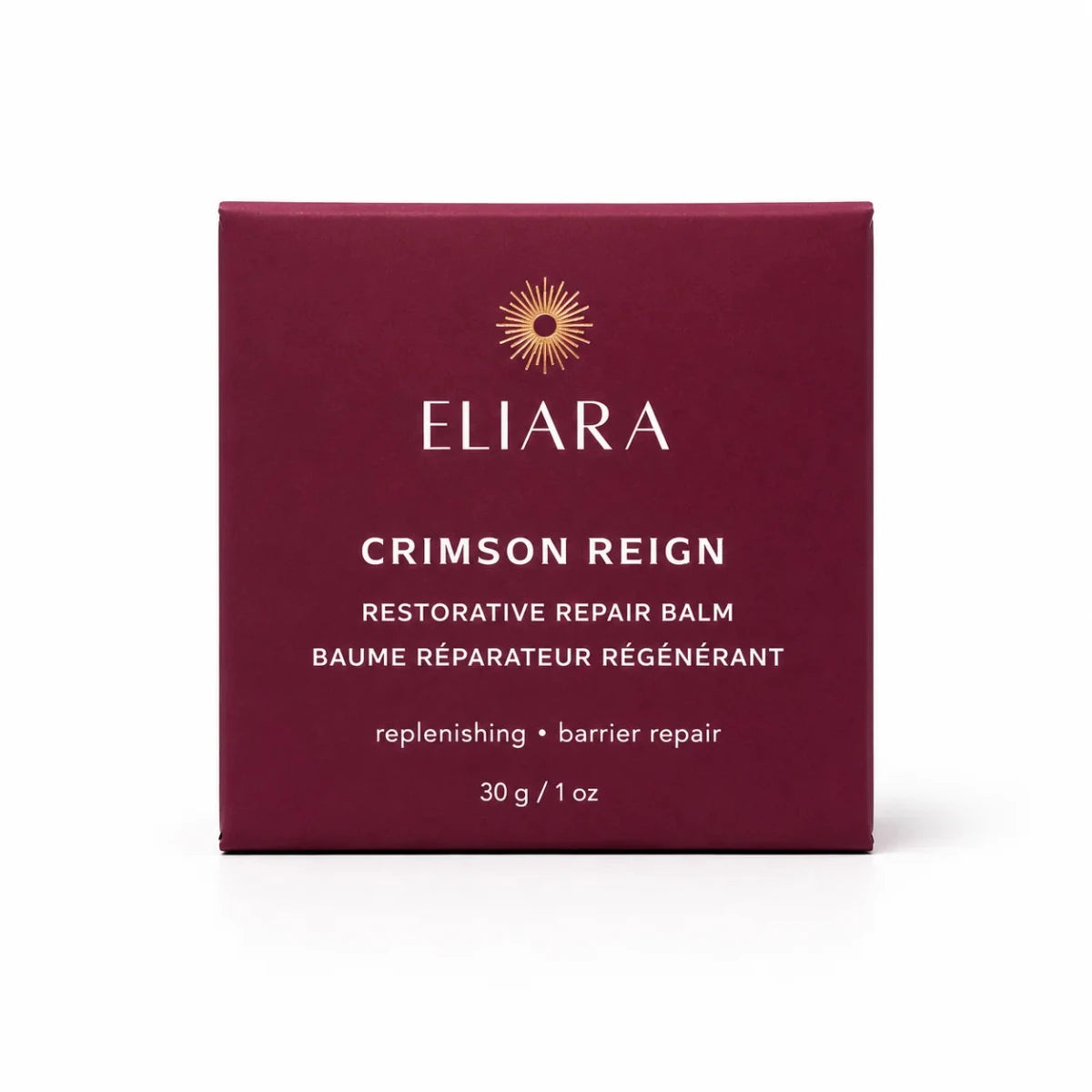 A square burgundy box of Eliara Crimson Reign Restorative Repair Balm, featuring white text and a gold sunburst logo, set against a plain white background.