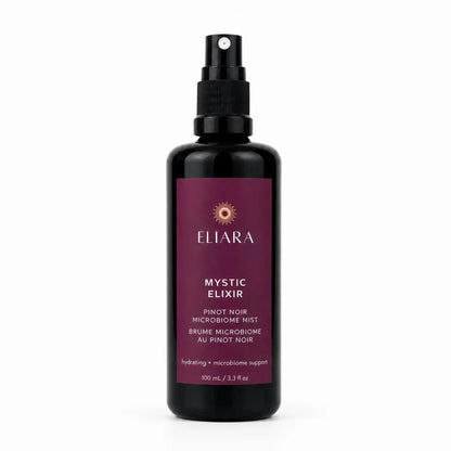 A 100 mL black spray bottle of Eliara Mystic Elixir Pinot Noir Microbiome Mist, featuring a deep burgundy label with gold and white text, set against a plain white background.